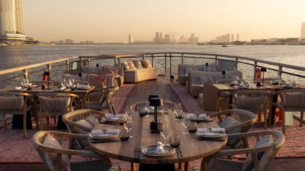 Private dining setup inside Lady Nara featuring elegant tables arranged for an intimate sea experience.