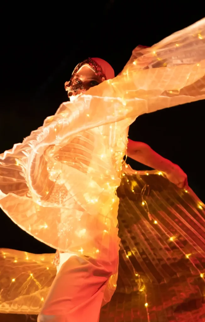 Fire performance creating a dramatic entrance for a luxury milestone celebration.