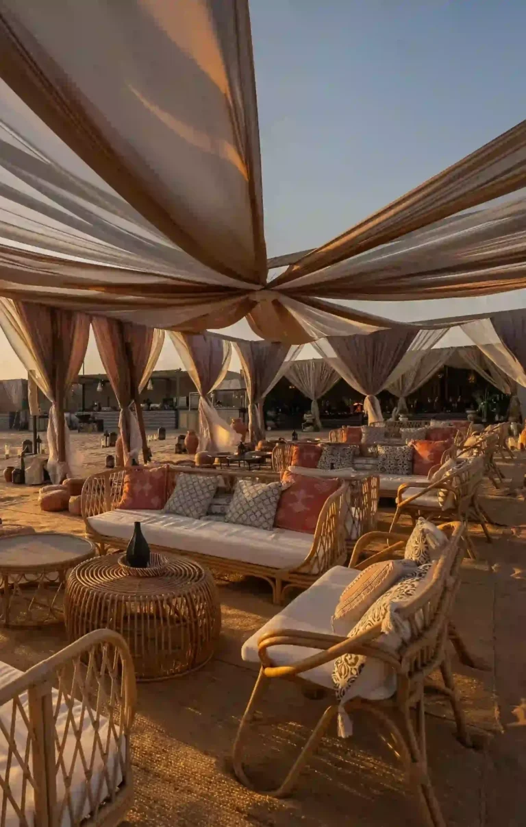 Sunset view over the desert with Ramadan dining tables set for iftar at the Ramadan Nights celebration