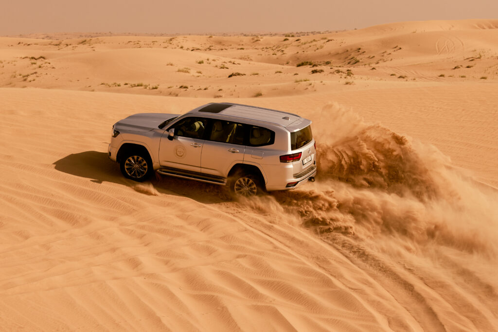Dune bashing in a 4x4 in the Dubai desert with Nara Desert Experiences. 