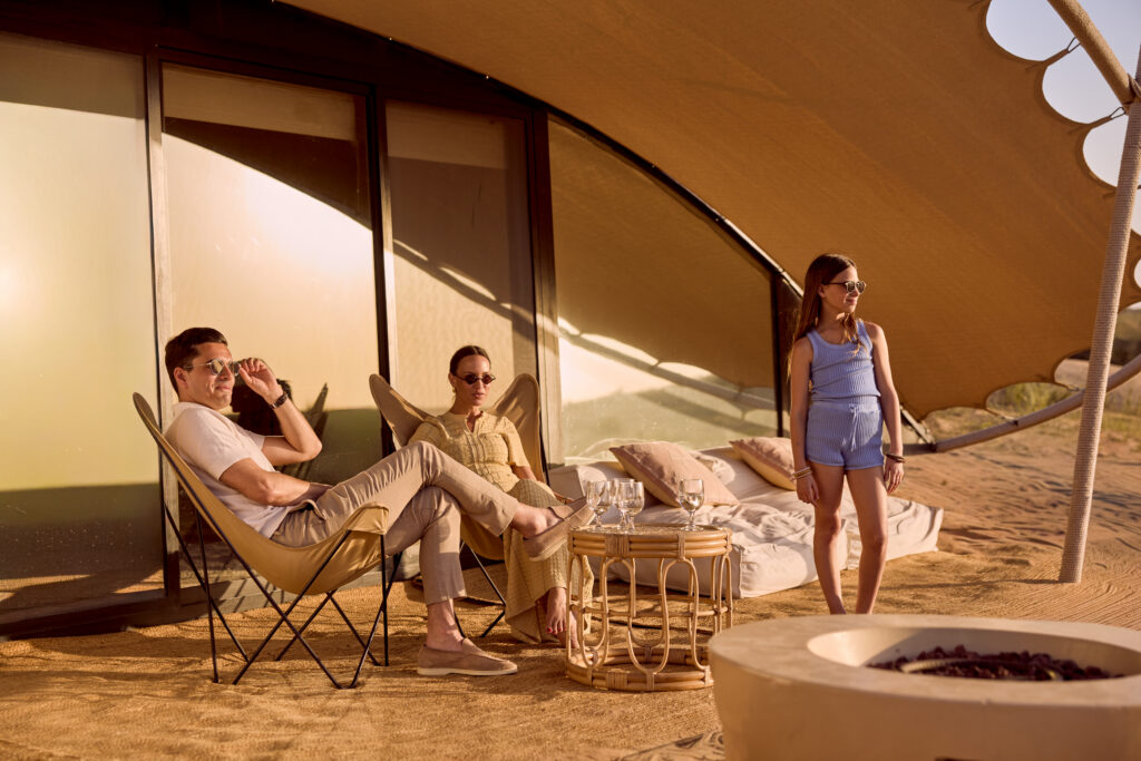 A family looking at the sunrise in The Nest in Dubai. 